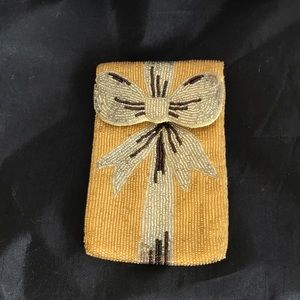 Neiman Marcus gold beaded phone case